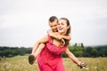 Single mom has fun with her son in nature. A mother brings up a child without a father. Not a complete family. The theme of Royalty Free Stock Photo