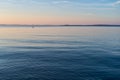 Single mooring buoy floating in Penobscot Bay in Maine at sunrise on a summer morning