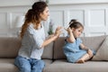Young mother scolding naughty little misbehave daughter Royalty Free Stock Photo