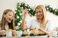 Single mother preparing breakfast for her teenage daughter on Christmas morning Royalty Free Stock Photo