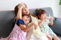 Single mother working at home Tired, busy with work and having to take care of two daughters Royalty Free Stock Photo