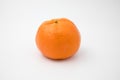 Single orange citrus fruit against white isolated background