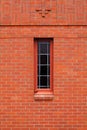 Single narrow window in brick wall Royalty Free Stock Photo