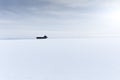Single old shack on a snow field Royalty Free Stock Photo