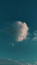 A single one big piece of white fluffy cloud in the blue sky Royalty Free Stock Photo