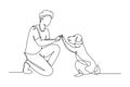 Single one line drawing of young happy boy giving high five gesture to his puppy dog at outfield park. Pet care and friendship