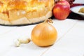 A single onion and three garlic cloves Royalty Free Stock Photo