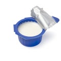 Single open blue plastic cup of coffee creamer Royalty Free Stock Photo