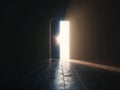 Illuminated Open Door in Dark Room Royalty Free Stock Photo