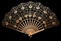 single open hand fan with intricate patterns, isolated on black