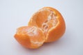 Single orange citrus fruit broken open