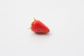 Single organic and fresh strawberry on a white background. Royalty Free Stock Photo