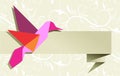 Single Origami hummingbird over floral background