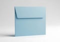 A single pale blue square envelope stands upright against a plain white background Royalty Free Stock Photo