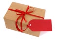 Single parcel or gift tied with red gift tag label isolated on white background Royalty Free Stock Photo