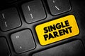 Single Parent - someone who is unmarried, widowed, or divorced and not remarried, text button on keyboard, concept background