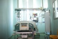 Single patient room with observation window in the intensive care unit, unfocused background