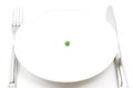 Single pea on a plate Royalty Free Stock Photo