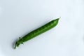 Pea pod on a white background Royalty Free Stock Photo