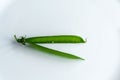 Pea pod on an isolated white background Royalty Free Stock Photo