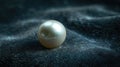 A single pearl with its lustrous sheen and soft iridescence, elegantly placed on a dark velvet surface, radiating luxury