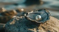 A single pearl sitting in an open oyster shell, placed on a smooth Royalty Free Stock Photo