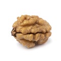 Single peeled walnut on white background close up