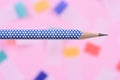 Single pencil on colorful background