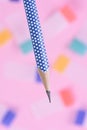 Single pencil on colorful background