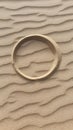 Single perfect circle drawn in sand Royalty Free Stock Photo