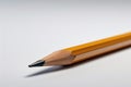 Lone perfectly sharpened pencil, minimalist white background, creativity simplicity, generative AI