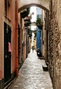 Single person in a long mediterranean alley