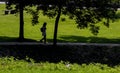 Single person silhouette walking in the `Pontido` village park, Povoa de Lanhoso.