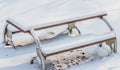 Single picnic table covered in snow Royalty Free Stock Photo