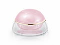 Single pink dome cosmetic jar on white