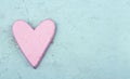 Single pink heart on light blue wooden background Royalty Free Stock Photo