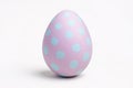 Single pink painted Easter egg with blue dots Royalty Free Stock Photo