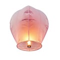 A delicate pink paper sky lantern with a warm glowing flame inside isolated on white background Royalty Free Stock Photo