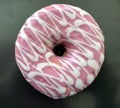 Pink and white iced donut Royalty Free Stock Photo