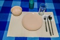 Single place setting on blue checked table cloth Royalty Free Stock Photo