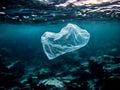 A single plastic bag floats in the blue ocean water, highlighting the problem of plastic pollution in our oceans Royalty Free Stock Photo
