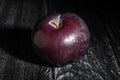 single plum on wood