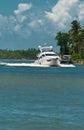 Single power boat cruising an inlet to a tropical marina on the Gulf of mexcico on a sunny, autumn day Royalty Free Stock Photo