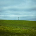 Single power line in green hill fields in SkÃÂ¥ne Scania Sweedn