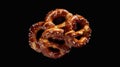A single pretzel on a dark or black surface Royalty Free Stock Photo