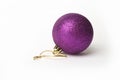 Single purple bauble on a white background