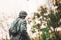 Single Re-enactor Dressed As German Wehrmacht Infantry Soldier In World War II Walking In Patrol Through Autumn Forest