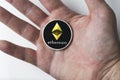 Single Real coin of cryptocurrency Silver Ethereum on white background