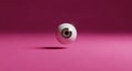 Minimalist Eyeball Floating in Pink Space Royalty Free Stock Photo