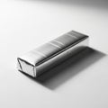 Silver Wrapped Rectangular Object with Subtle Stripes and Shadow on White Surface Royalty Free Stock Photo